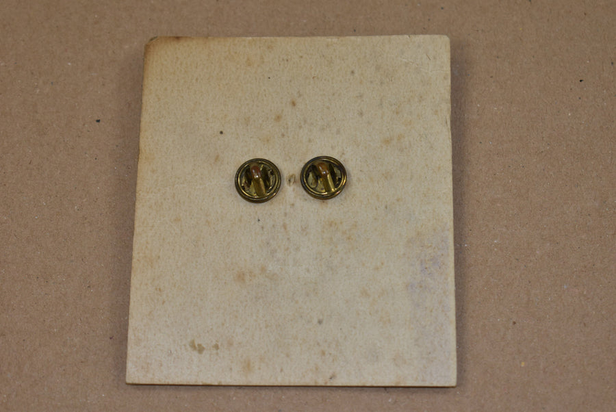 Disque de col monogramme US sur carte